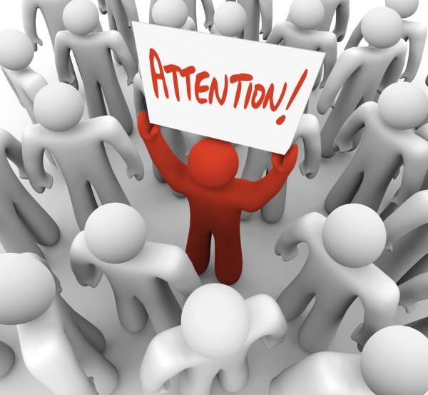 depositphotos 5999234 stock photo person holding attention sign in